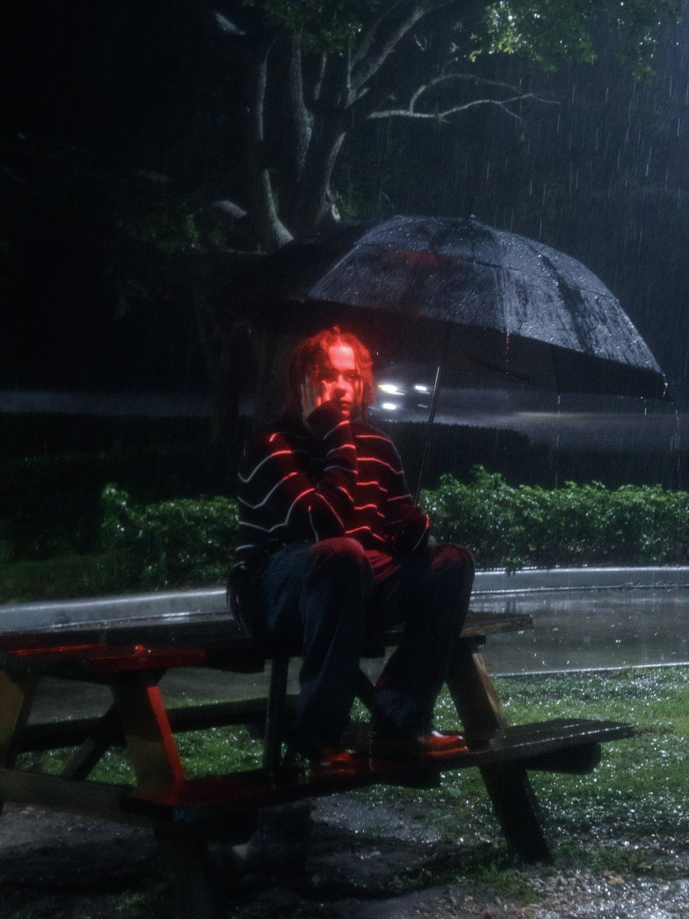 FOR4IGN standing with his umbrella